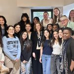 A diverse group of young women gathers with Irish Ambassador Lisa Carty and Loretto at the UN representative Beth Blissman for a photo.
