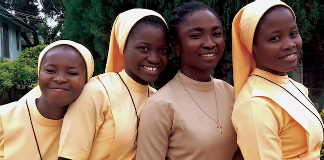 Left, young Ghanaian religious sisters and a postulant (without the veil) smile for the camera.