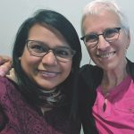 Two Catholic sisters take a selfie together, on the left is a novice from Pakistan and on the right is a sister with at many years of service.