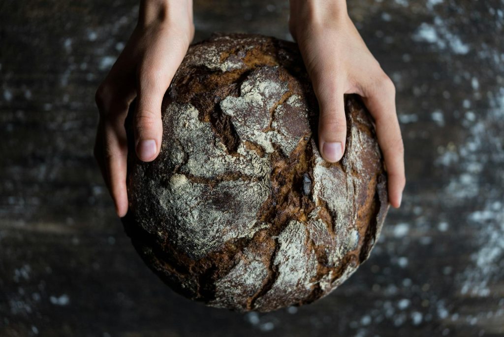 human holding a bread