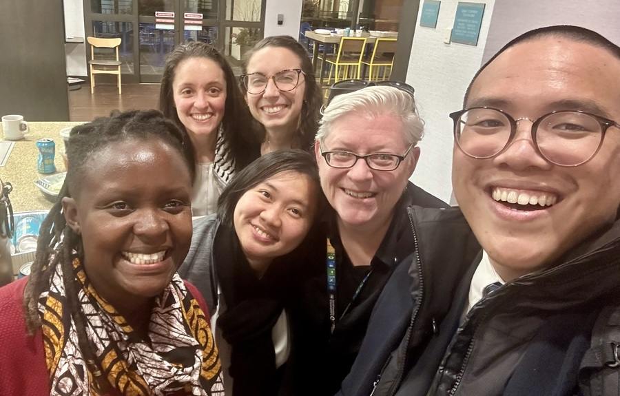 Beth Blissman CoL and five other people of varying ages and races smile for a selfie together.